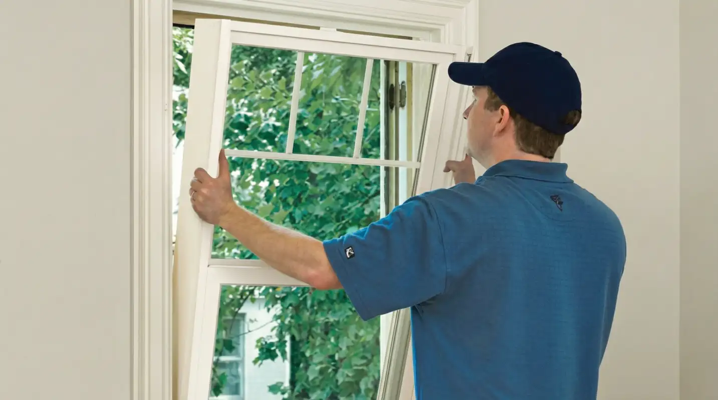 Professional contractors performing a residential window insulation and replacement service in Sacramento, CA